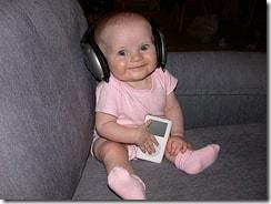 cute baby in pick, with headphones