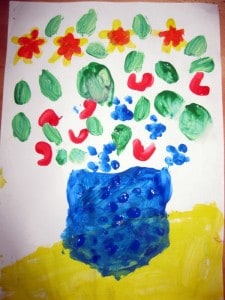 Vase with flowers, by child with finger-drawing technique